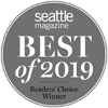 This image shows a gray circular badge with the text "Seattle Magazine Best of 2019 Readers' Choice Winner" on it.